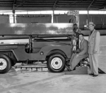 Sonja Henie in front of a Model B machine.