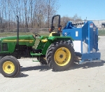 Zamboni Model 200 attached to a John Deere tractor.
